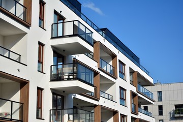 Multistory new modern apartment building. Stylish living block of flats.