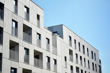 Multistory new modern apartment building. Stylish living block of flats.