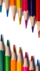 isolated colored pencils located diagonally on a white background
