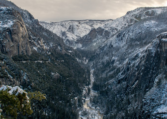 View of Yosemite from 120 near the parks entrance on a winters day featuring the Merced River and valley below