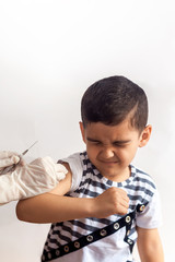 A doctor vaccinating young patient. Little boy scared of injection. Child's Immunization, Children's Vaccination, Health concept.