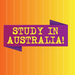 Handwriting text Study In Australia. Conceptual photo going into foreign country order complete your studies Blank Folded Color Banner photo on Vertically Striped Two Toned Backdrop