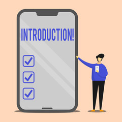 Handwriting text Introduction. Conceptual photo First part of a document Formal presentation to an audience Man Presenting Huge Blank Screen Smartphone while Holding Another Mobile