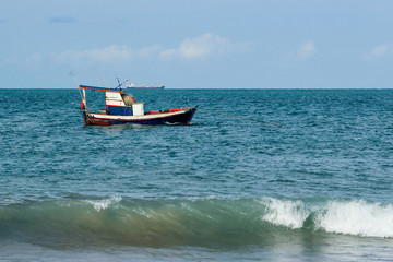 Obraz premium Fisherman's boat. Sailing the wind through the waves at sea.