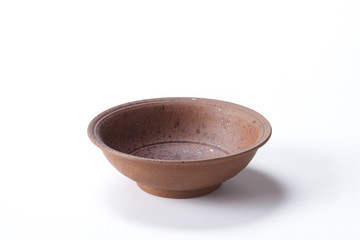 Close up Ceramic brown bowl isolated on white background shoot in the studio with space for copy.