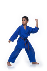 Master Blue 2 II Belt Kid TaeKwonDo show basic step of fighting pose, Asian athletes boy black hair tanned skin exercise warm up in blue uniform bare foots, studio lighting white background copy space