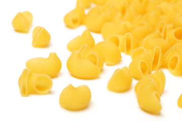 Italian pasta (Gomiti Rigati) on white background 
