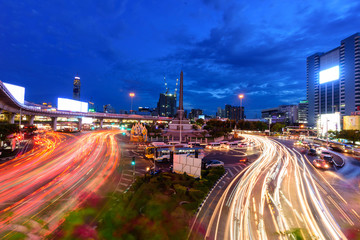 Fototapeta na wymiar victory monument landmark in Bangkok with blur light of traffic car