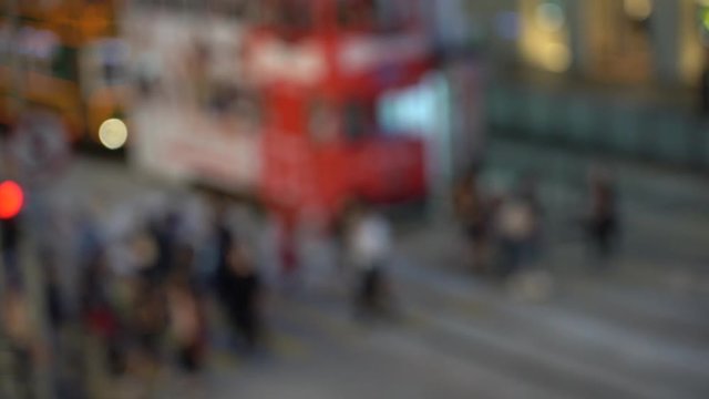 Blurred people on busy crosswalk; Slow motion