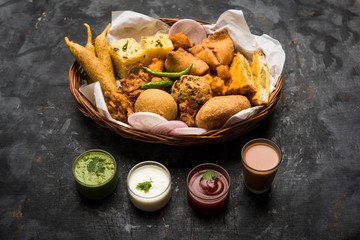 Indian Tea time snacks  in group includes Veg Samosa, Kachori/kachaudi, aloo bonda, khaman dhokla,...