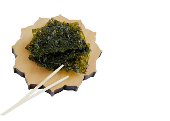 Crispy Nori Seaweed with sea salt on white background. Asian cuisine.Food background with copy space. 