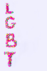 Letters L, G, B, T on a white background. Multicolored inscription LGBT. Gay parade, LGBT, bisexual, homosexual