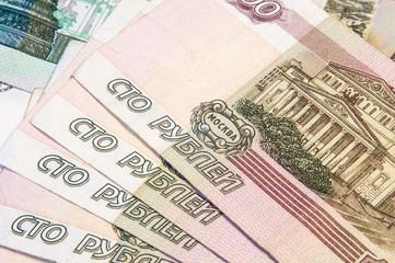 Money. Russian ruble. Banknotes in a hundred rubles of the Russian Federation. Cash. Background texture. Rub. Close up. Macro shooting.