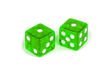 Two green glass dice isolated on white background. One and one.