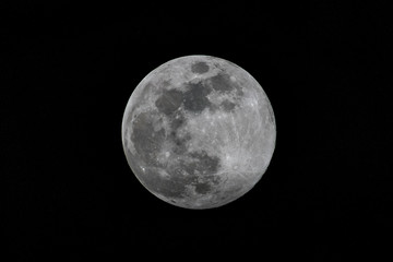 Isolated close up of a full moon in black and white
