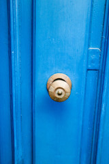 Door handle on the bright blue wooden door, Valletta, Malta