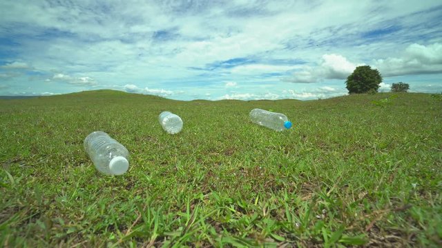 Plastic bottle on the grass,moving shot by stabilizer