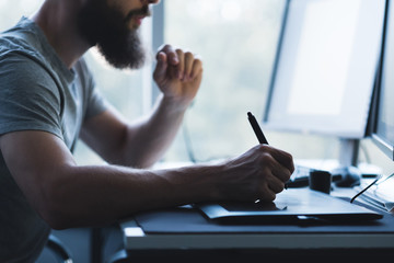 Web graphic design. Cropped shot of creative illustrator using tablet and pen for drawing. Copy space.