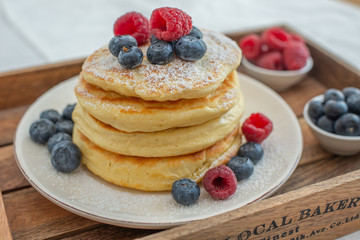 Delicious home made sweet vanilla pancakes with berries
