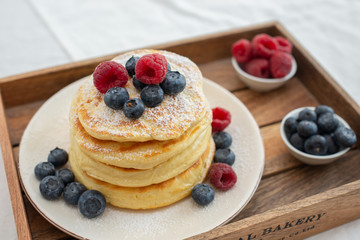 Delicious home made sweet vanilla pancakes with berries