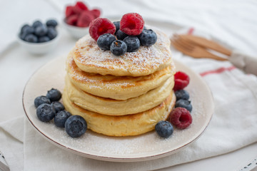 Delicious home made sweet vanilla pancakes with berries