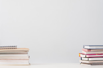 Education and knowledge. Book stacks on desk over white background. Empty space.