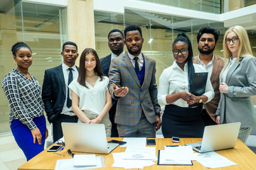 indian ,korean , afro-american businessman businesswoman work in modern background