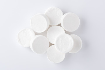 Facial sheet mask compressed on white background