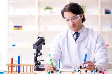 Young male scientist working in the lab 