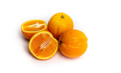 isolated on a white sprinkled water background, fresh, juicy orange fruits