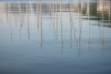 Reflections in the tranquil water of the fishing harbour