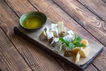 Cheese plate on a wooden table.