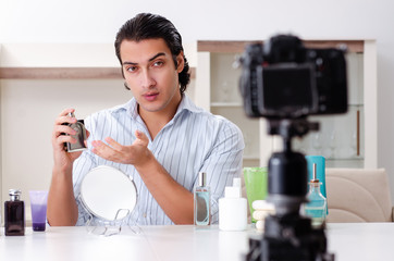 Young handsome man recording his blog in hygiene concept 