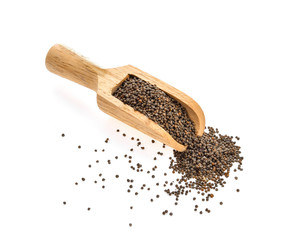 sesame seeds in wood scoop isolated on white background