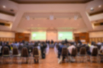 Blurred background of business people in conference hall or seminar room.