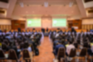 Blurred background of business people in conference hall or seminar room.