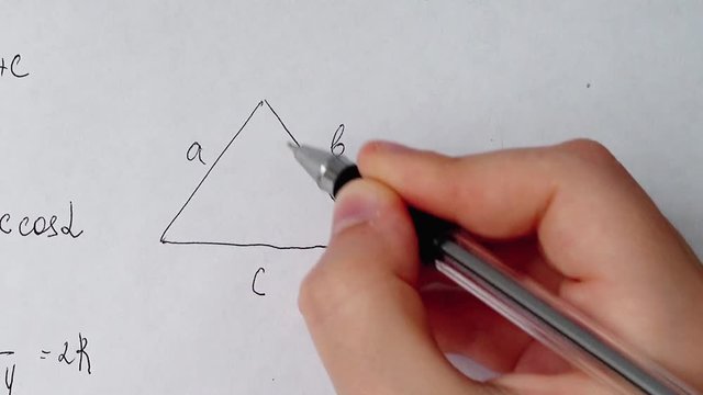 Writing of mathematical formulas on paper. Work of the mathematician.