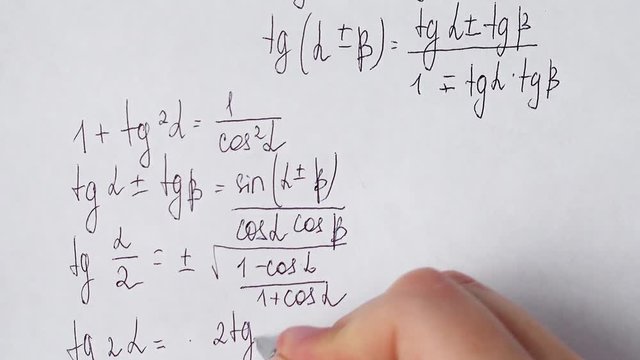 Writing of mathematical formulas on paper. Work of the mathematician.