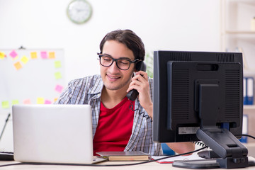 Male it specialist working in the office 