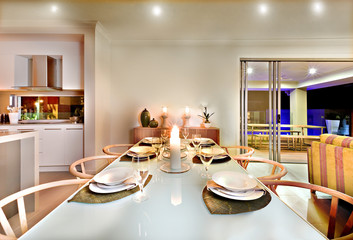 Dinner table settings in a house at night