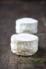 Soft french cheese of camembert on wooden table
