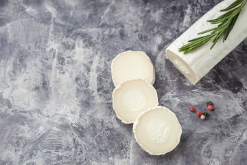 Fresh goat cheese with slices dark marple