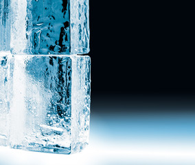 Textured frosty crystal clear ice blocks isolated on black background with copy space.