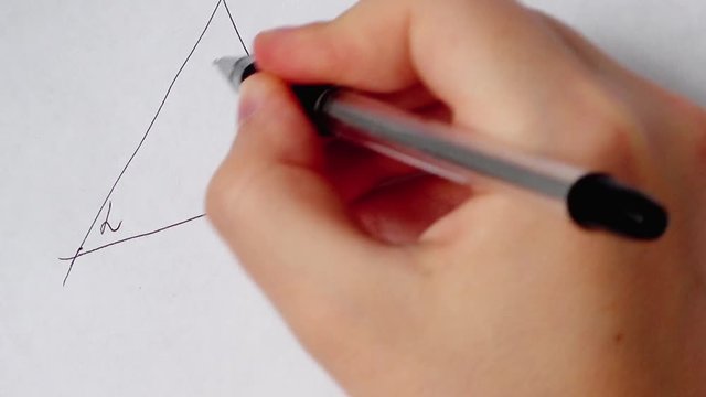 Writing of mathematical formulas on paper. Work of the mathematician.