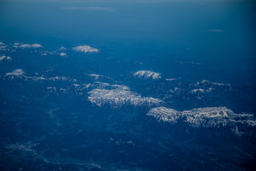 Fototapeta na wymiar snowy mountains, top view. Fog