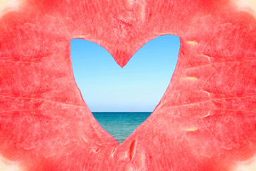 Texture of the huge ripe piece of watermelon with heart shape hole on the sea background.