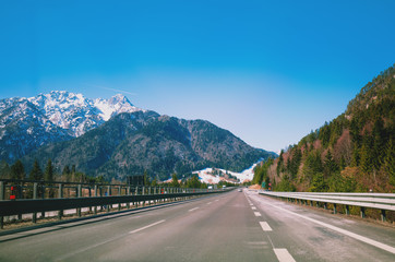 Driving a car on the autobahn between the mountains in Slovenia