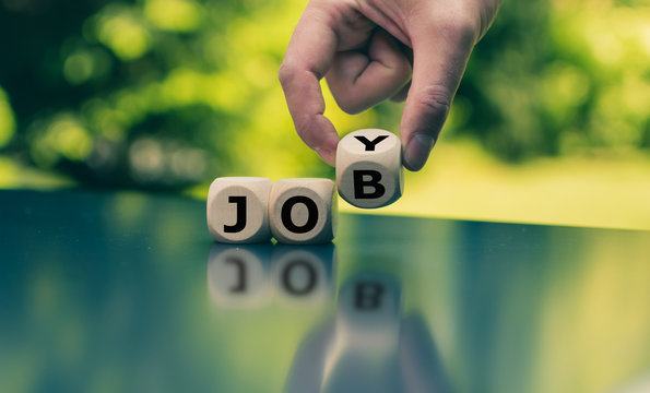 Concept for fun at work. Hand turns a cube and changes the word "job" to "joy".