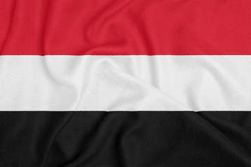 Flag of Yemen on textured fabric. Patriotic symbol