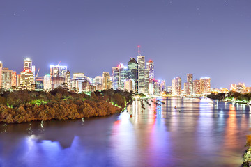 Brisbane City at night beside a river with sky